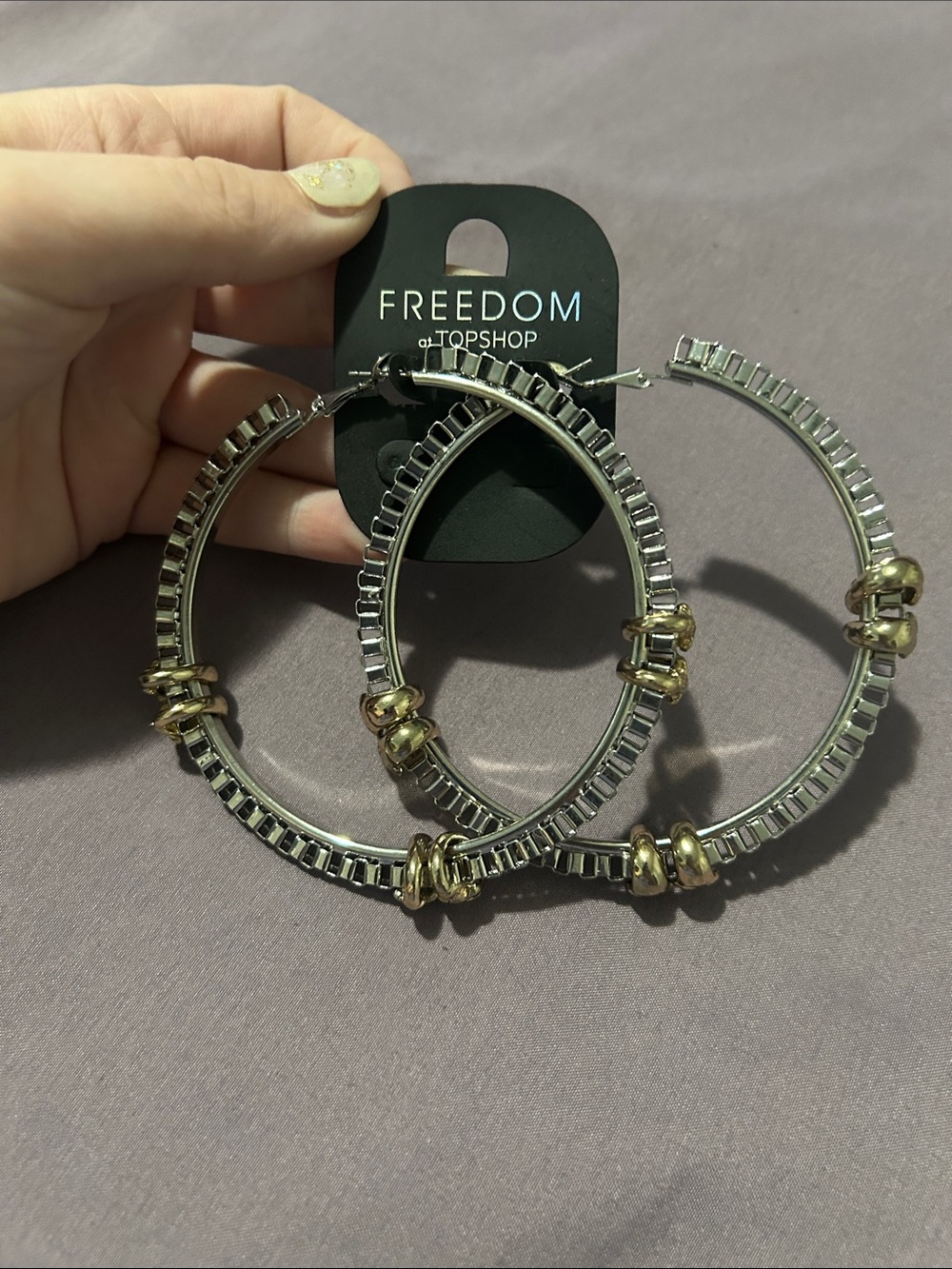Two-Tone Silver and Gold Hoop Earrings with Skulls